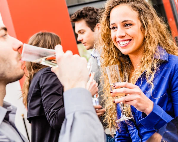 Young people drinking wine in restaurant — Stock Photo, Image