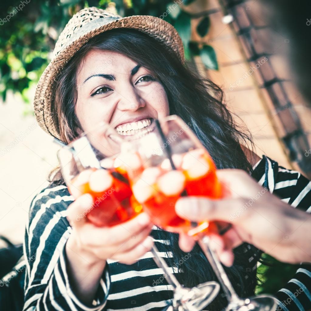 Teenage Girl Toasting with Aperitif Cocktail 