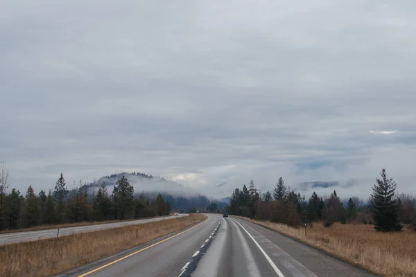 Highway Road Signs Sides High Mountains Clouds Winter Which Trucks — Stock Photo, Image