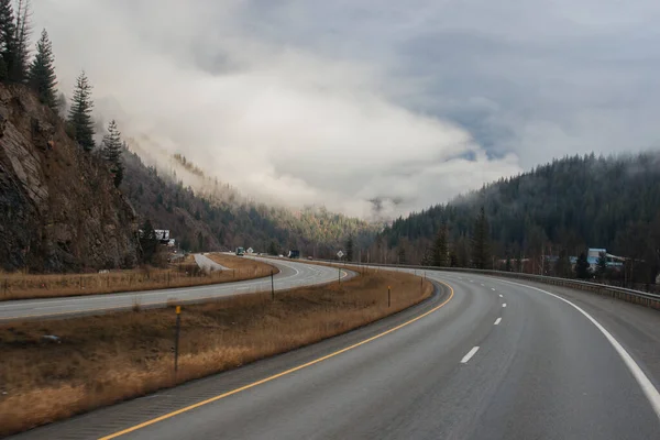 Highway Road Signs Sides High Mountains Clouds Winter Which Trucks — Stock Photo, Image