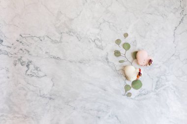 Macaroons close up. Pink and white macaroons on the murble table. Background for Valentine's Day