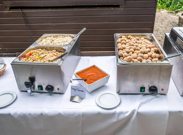 White beans and potatoes stew cooking steaming with red Mojo Dip during buffet Catering Dining Eating Party Concept — Stock Photo, Image