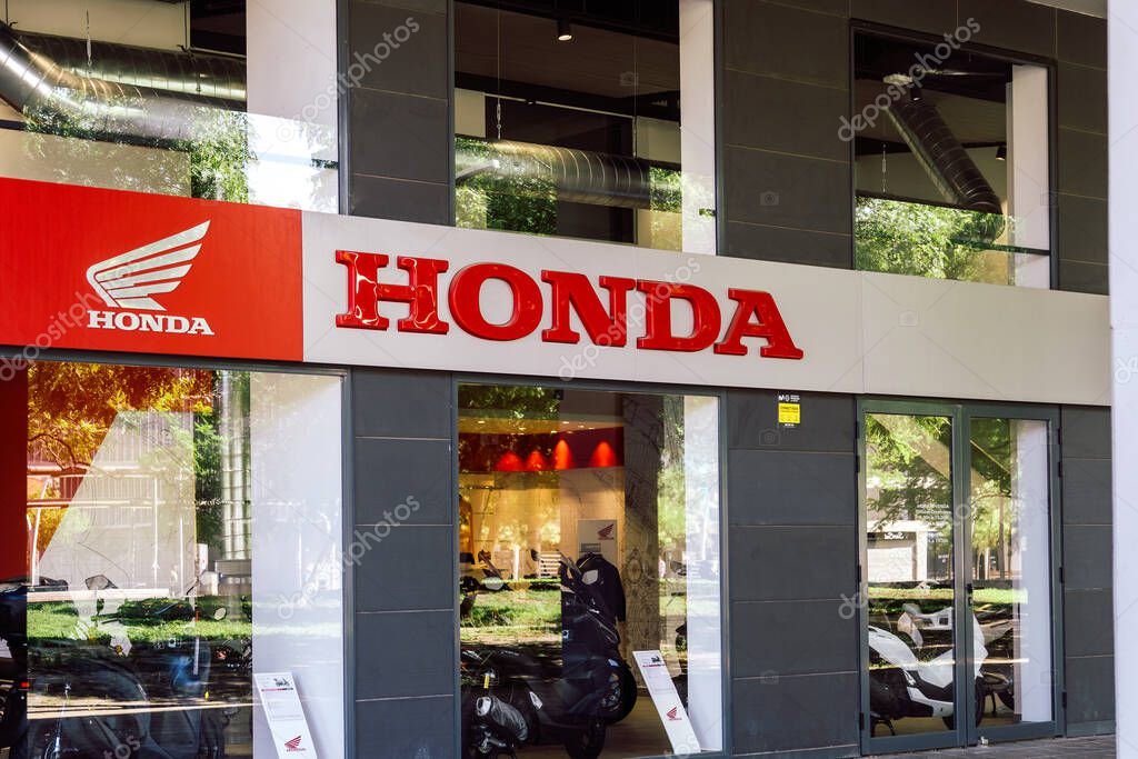 Barcelona, Spain-July 26, 2025. Exterior View of Honda Car and Motorcycle Dealership Showroom