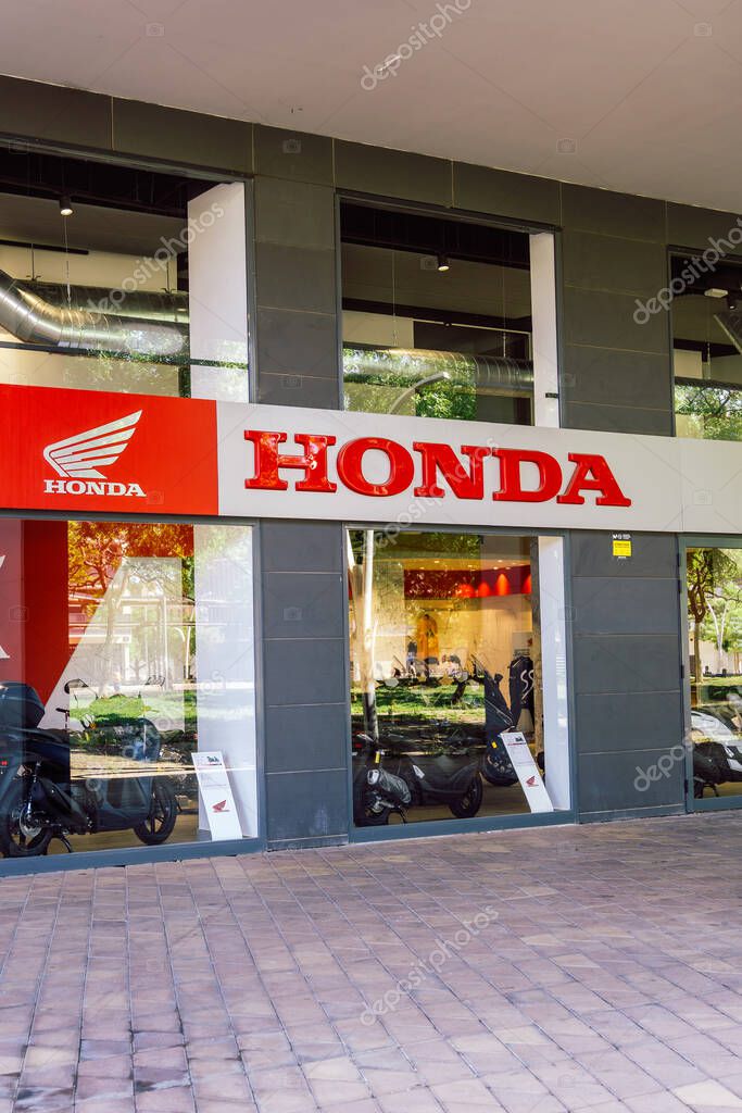 Barcelona, Spain-July 26, 2025. Exterior View of Honda Car and Motorcycle Dealership Showroom