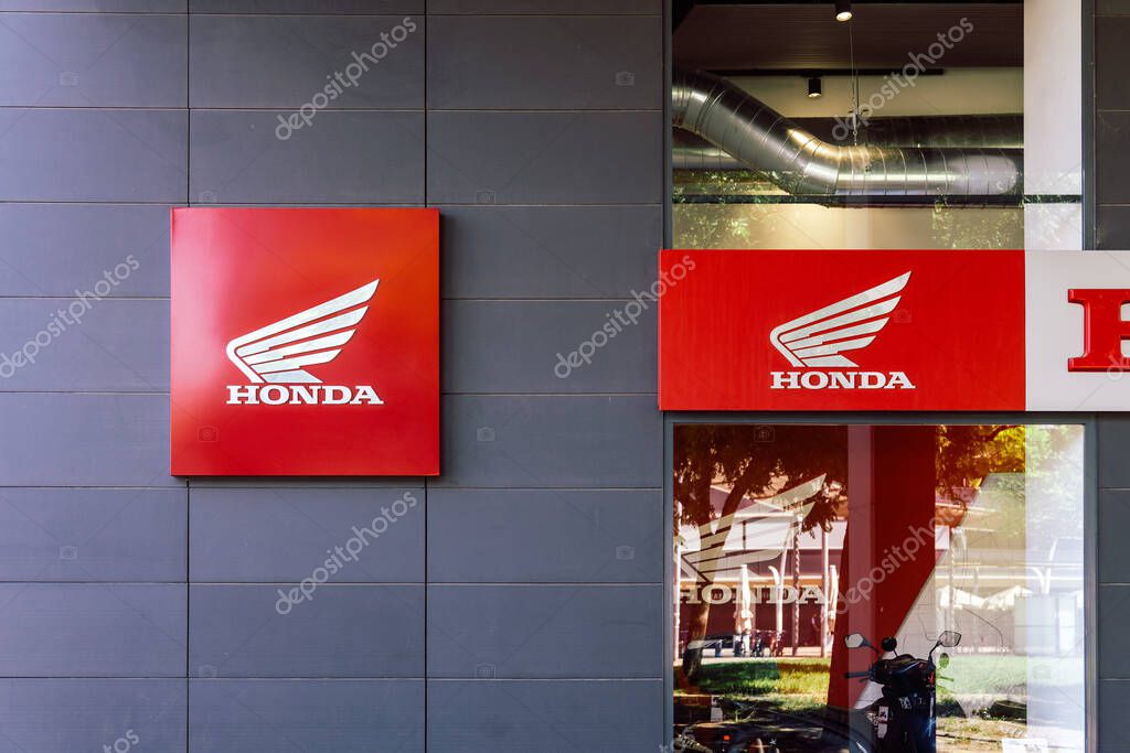 Barcelona, Spain-July 26, 2025. Exterior View of Honda Car and Motorcycle Dealership Showroom