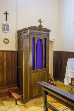 Huesca, Spain-August 20, 2023. Wooden confessional in a church in Spain