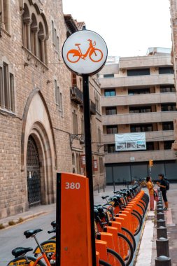 Barcelona, Spain - August 18, 2022. Public bicycle rental service in the city of Barcelona, Spain. Users pay an annual subscription to access mechanical and electric bicycles.