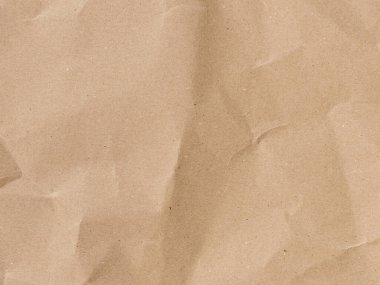 Kahverengi kağıt desenli arka plan. İplik ve düzensiz elementlerle geri dönüştürülmüş madde. Paketin kırışıklıklar ve kıvrımlarla soyut arkaplanı.