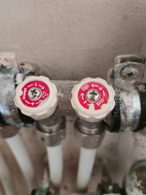 Close-up of radiant floor heating manifold with white pex pipes and valves. Varna. Bulgaria.  09.10.2025