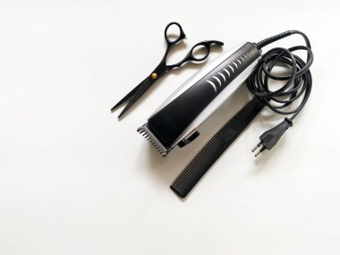 A set of barber tools is displayed on a white background.