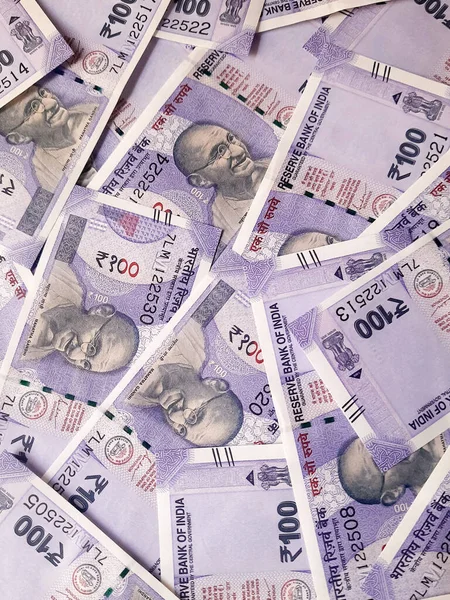 Close up view of indian 100 rupees banknotes. Indian currency. Colorful money background