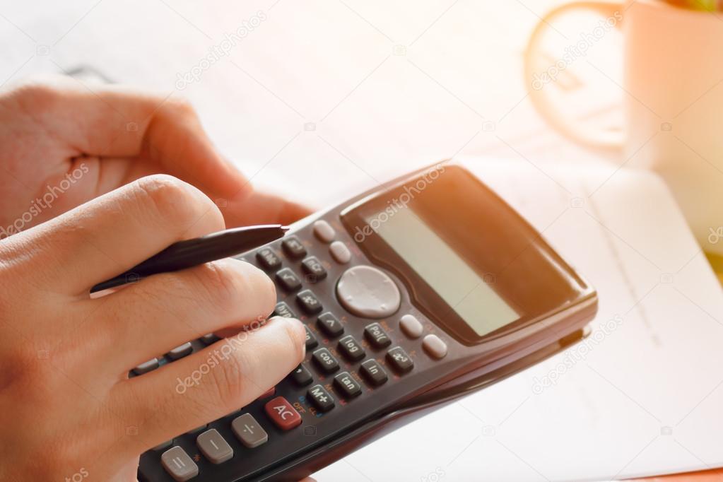 savings, finances, economy and home concept - close up of man wose up of hands and stationery, soft focus