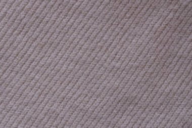 Örülmüş pastel pembe süveter dokusu, yakın çekim bej pembe örgü kumaş dokusu.