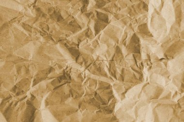 Kahverengi buruşmuş geri dönüşümlü kağıt doku arka planı. Kahverengi buruşmuş geri dönüşümlü karton yaprağın Kraft Kağıt dokusu arka planı