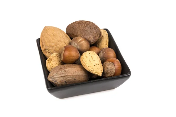 Pile Assorted Nuts Shell Black Bowl Isolated White — Stock Photo, Image