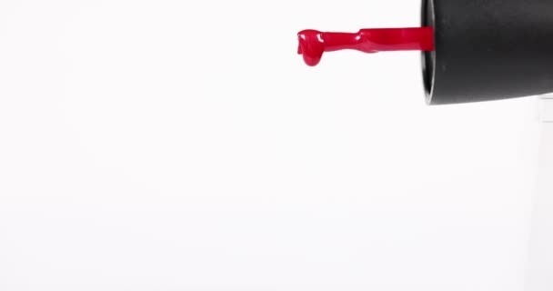 Single Red Drop Oozes Slowly Nail Brush Falls Away — Stock Video