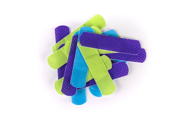 Stapel Van Veelkleurige Groene Paars Blauwe Bandage Strips Top View — Stockfoto