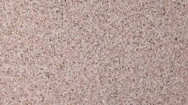  Spinning light colored pin cushion cork texture background