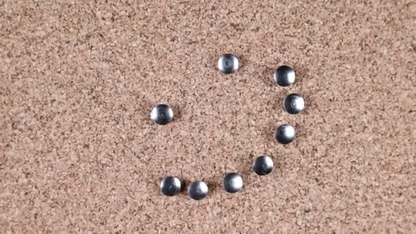 Spinning Smile Made Out Silver Thumb Tacks Poked Cork Board — 图库视频影像