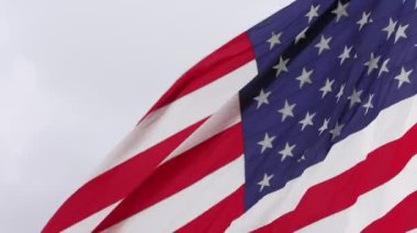 Close up backlit american flag rippling in the wind