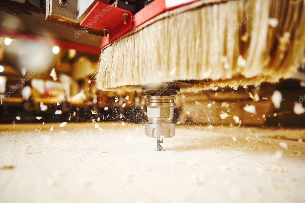 Close-up shot of cutting wood with a cnc milling machines.