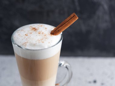 Coffee latte in a glass on a concrete table