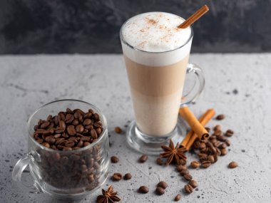 Coffee latte in a glass on a concrete table