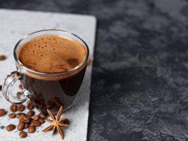 A Cup of espresso on a two-tone concrete background
