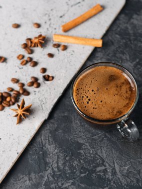 A Cup of espresso on a two-tone concrete background