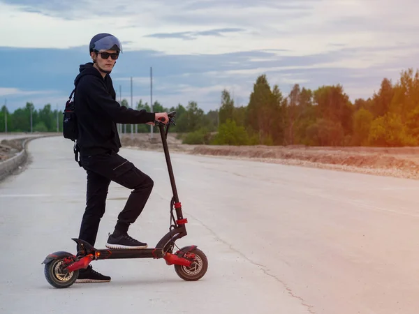 Young Man Wearing Helmet Rides Powerful Modern Electric Scooter Unfinished — Stock Fotó