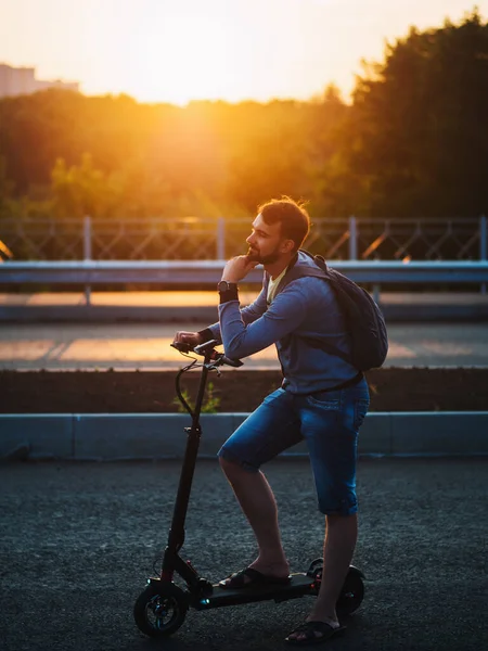 Man Rides Electric Scooter Sunset Ecotransport Future Summer Time — Stock Fotó