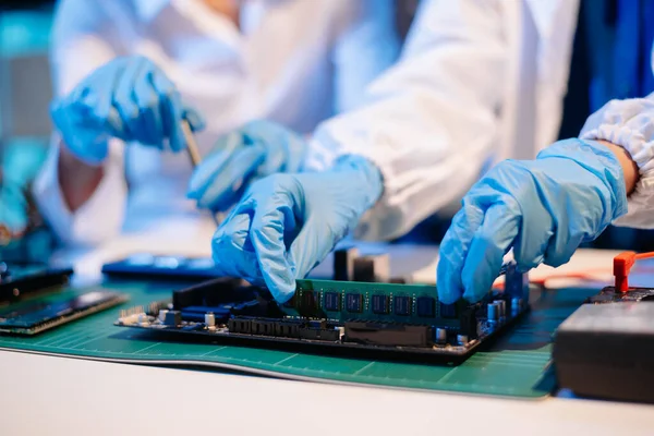 Electronics assembly and RAM installation with high-tech components. Ideal for showcasing advanced technology and computer engineering concept