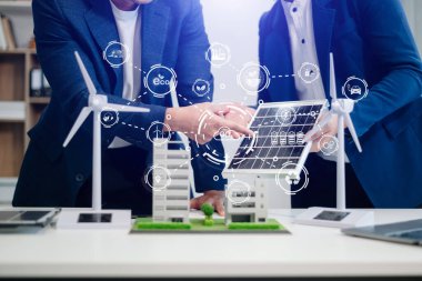 Business team working virtual modern smartphone to reduce CO2 emissions carbon footprint climate change to limit global warming.Sustainable development and green business concept. at offic