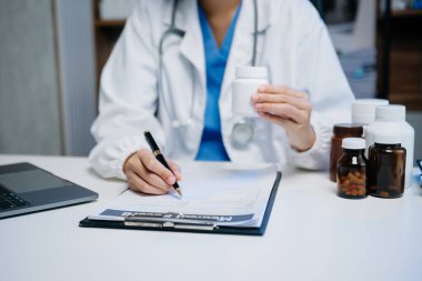 Medical technology concept. Doctor working with mobile phone and stethoscope in modern office