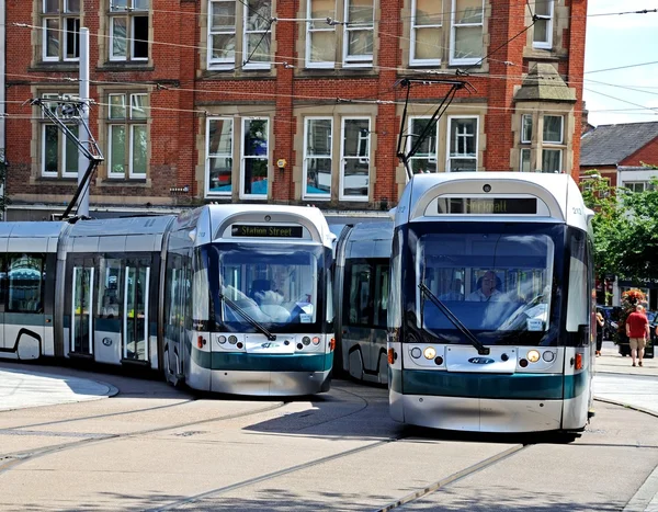 Modern trams travelling round the Old Market Square, Nottingham. — Stock Photo, Image