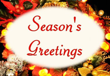 Bir Noel arka plan karşı ayarlanmış oval bir çerçeve içinde Seasons Greetings mesajı