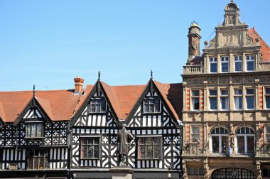 Tudor buildings around The Square with the Clive of India statue in the foreground, Shrewsbury. clipart