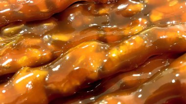 Parlak Churchkhela yakın plan. Geleneksel Türk / Gürcü cevizi ve üzüm pekmezli tatlı, Cevizli Sucuk Macro shot 'ı. Kehribar rengi, zengin doku..