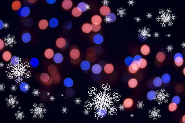 Copos de nieve blancos sobre el fondo rosa y azul bokeh — Foto de Stock