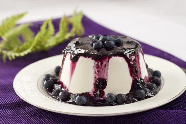 Sweet pudding with blueberry confiture — Stock Photo, Image