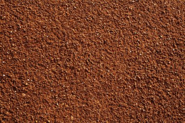 Kırmızımsı Kahverengi Granüler Doku Arkaplanı. Doğal Toprak Kum Çekirdeği Yüzeyi, Tasarım ve İnşaat İçin Kırsal Toprak Soyut Doku Kullanımı