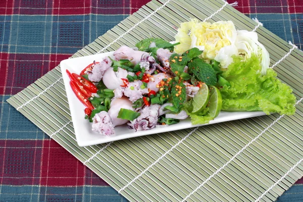 Spicy and sour mixed herb salad with squid wrap minced pork on bamboo. Side view — Stock Photo, Image