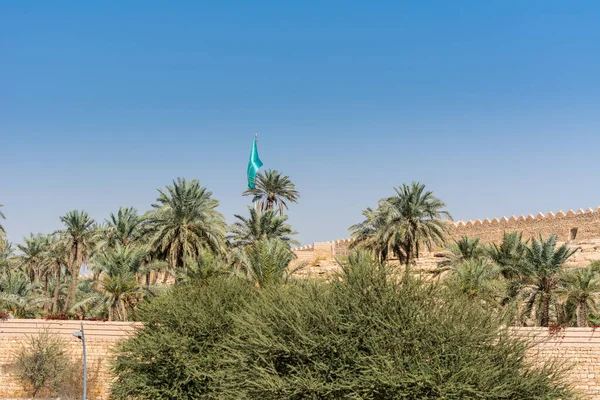 Date trees and ruins of Diraiyah clay castle, also as Dereyeh and Dariyya, a town in Riyadh, Saudi Arabia, was the original home of the Saudi royal family, and the capital of the Emirate of Diriyah.