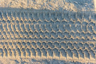 Kum parkındaki lastik izlerinin arka planı 