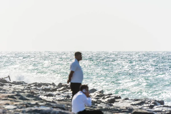 Blurred Two Indian Man Watching Seascape Crescent Road Breakwater Stones — Stock Photo, Image