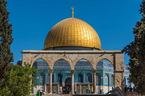 The Golden Dome of the Rock, or Qubbat al-Sakhra, and stone gate ruins in an Islamic shrine located on the Temple Mount in the Old City of Jerusalem.