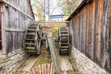 Authentic peasant farms and Waterwheel  from all over Romania in Dimitrie Gusti National Village Museum, an open-air ethnographic museum located in the King Michael I Park, showcasing traditional Romanian village life