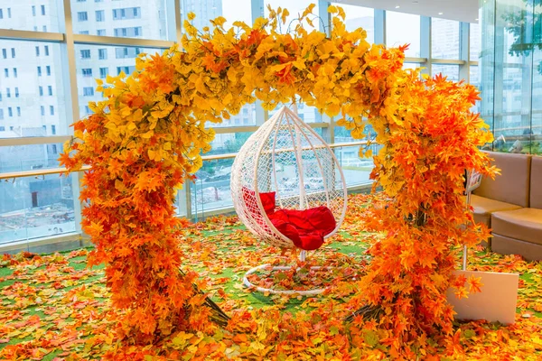 Arch Orange Fall Foliage Hanging White Chair — Stock Photo, Image