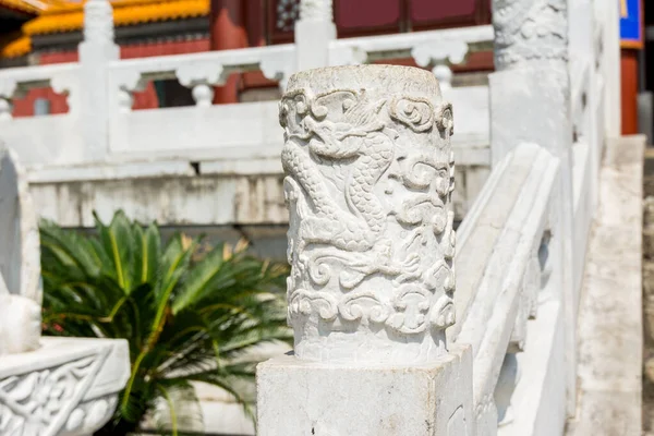 Chinese traditional culture, ancient Chinese marble guardrail with ornamental dragon carving, ornamental column in front of new yuan ming palace, Zhuhai, China