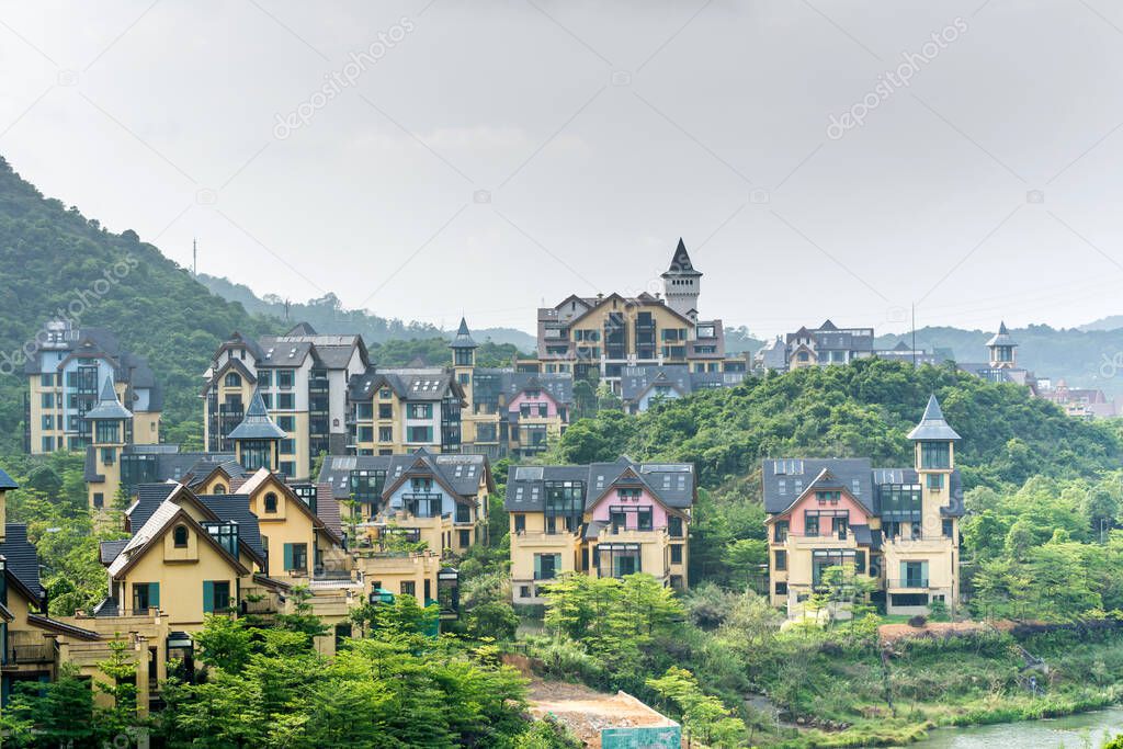 Luxury European villa at the bottom of mountain at summer time in the Oversea Chinese Town (OCT east ) of Shenzhen, China